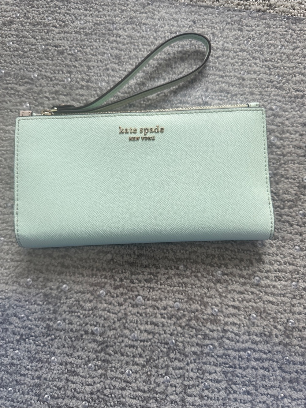 kate spade mint green wristlet wallet with gold logo